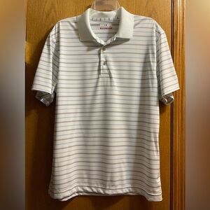 Grand Slam Men's Polyester Short Sleeve White Polo with Blue and Black Stripes.